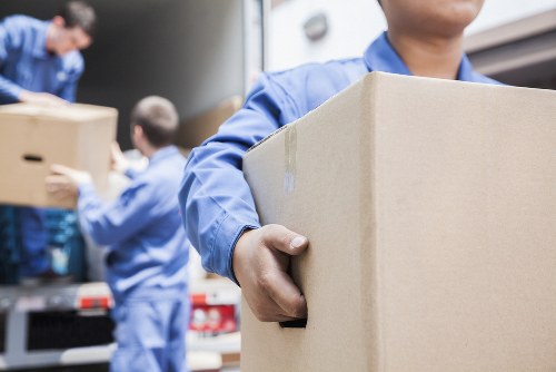 Movers Surrey team preparing a safe home move with protective packing equipment