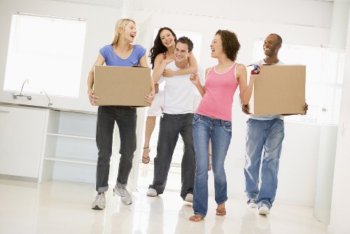 Moving truck and packed boxes for a Surrey home relocation