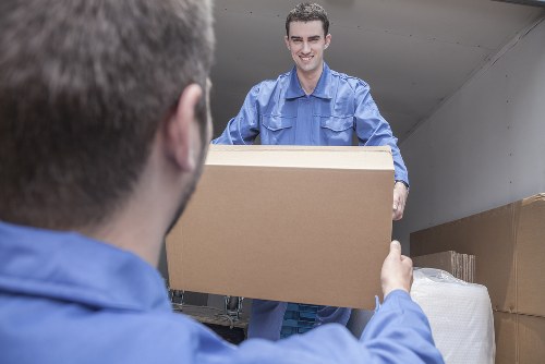 Moving team handling student furniture in a Surrey property