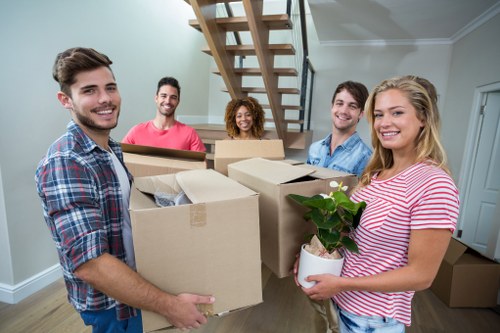Movers Surrey team handling boxed items during a relocation service