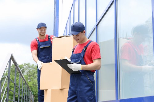 Removal team loading boxes and furniture from a Surrey apartment block