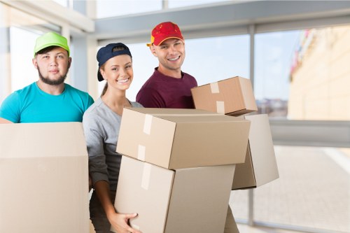 Packed household boxes and furniture prepared for a Surrey domestic move