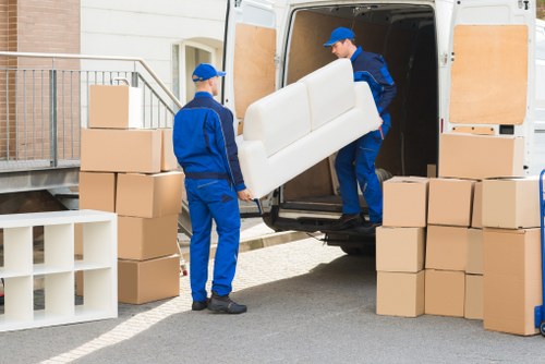Removal team loading a home move van in Surrey