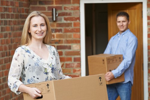 Packed boxes and furniture ready for a Surrey flat removal service