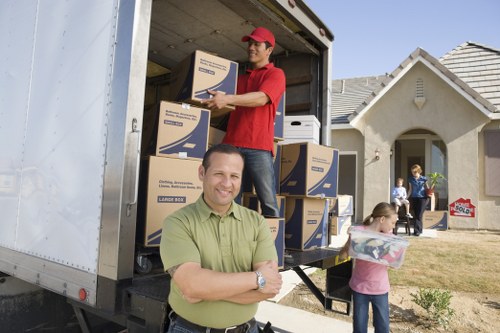 Professional Surrey moving service handling packed boxes carefully