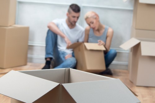 Packed moving boxes and furniture ready for removals in Surrey