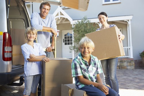 Removal van outside a Surrey property during moving day