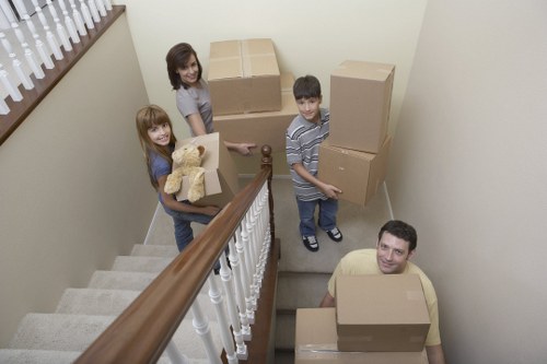 Movers planning access around stairs and narrow hallways in Surrey